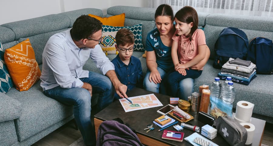 Father showing family members where to go during an urgent event